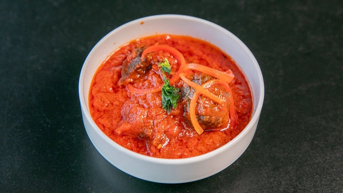Stewed beef in spicy tomato pepper sauce at Global Pot Fusion Cuisine in Winnipeg, MB