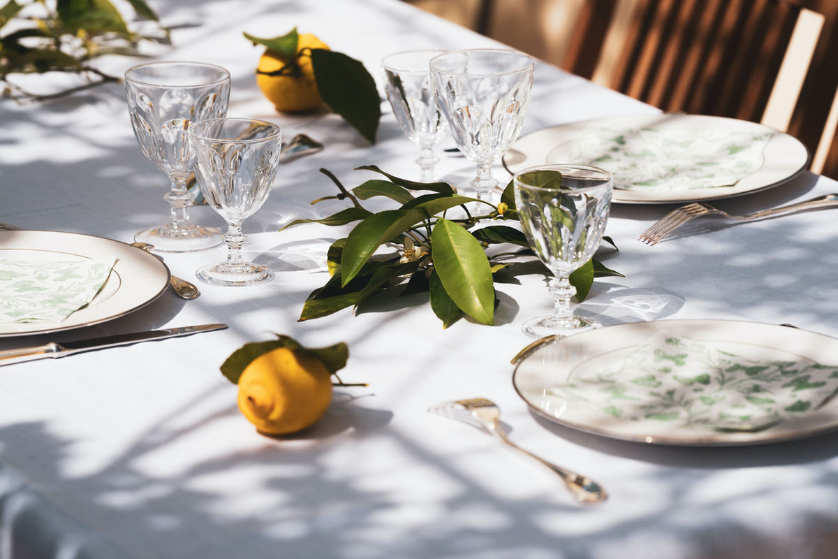 White linen table setting for a catered event - African catering Winnipeg
